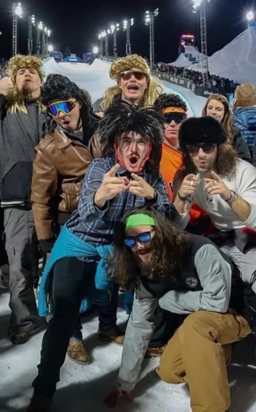 A crew of guys in mullets out at night